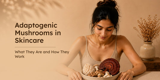A woman looking down at a bowl of adaptogenic mushrooms against a warm, neutral background.